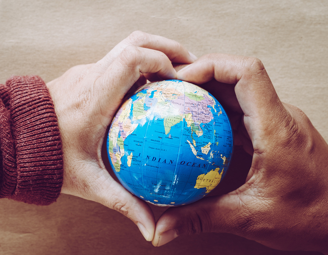 hands holding the world